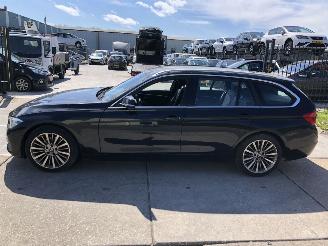 Coche accidentado BMW 3-serie 318i touring automaat veel opties 70 dkm 2019/4